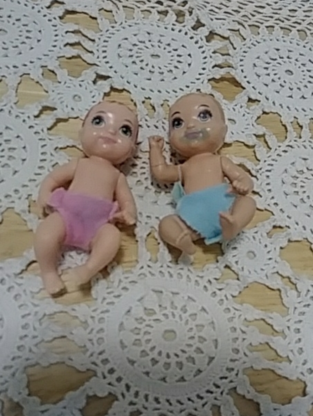 Vintage Mattel baby dolls with cloth diapers, one messy mouth version